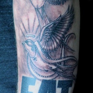 Angel bird - swallow tattoo by Robert Jarrett at 2 Ton Tattoo Gallery, Kingsport, TN