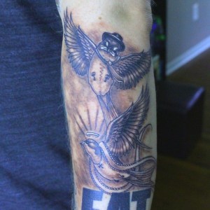 Swallow tattoos done by Robert Jarrett at 2 Ton Tattoo Gallery, Kingsport, TN