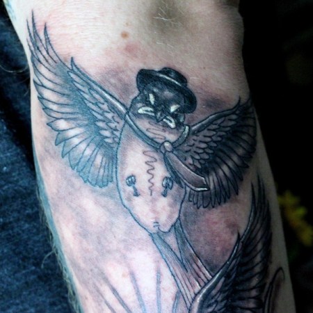Clown bird - swallow tattoo by Robert Jarrett at 2 Ton Tattoo Gallery, Kingsport, TN