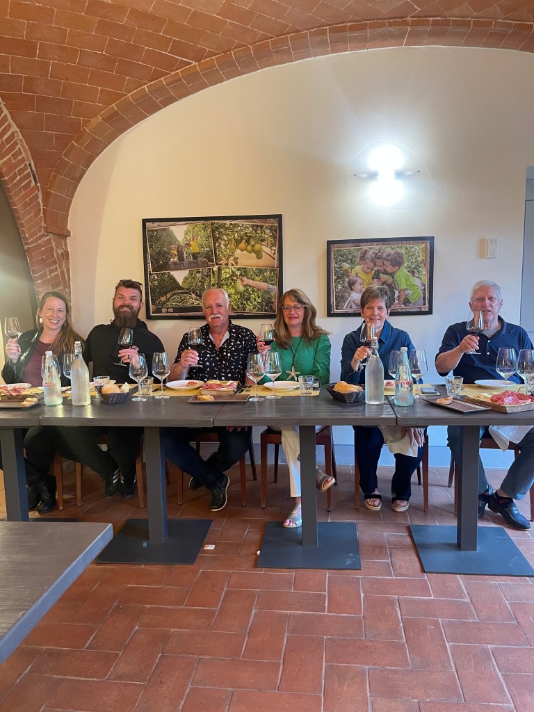 Us with our Canadian friends during the wine tasting at Podera la Rocca Agriturismo in Montepulciano, Italy
