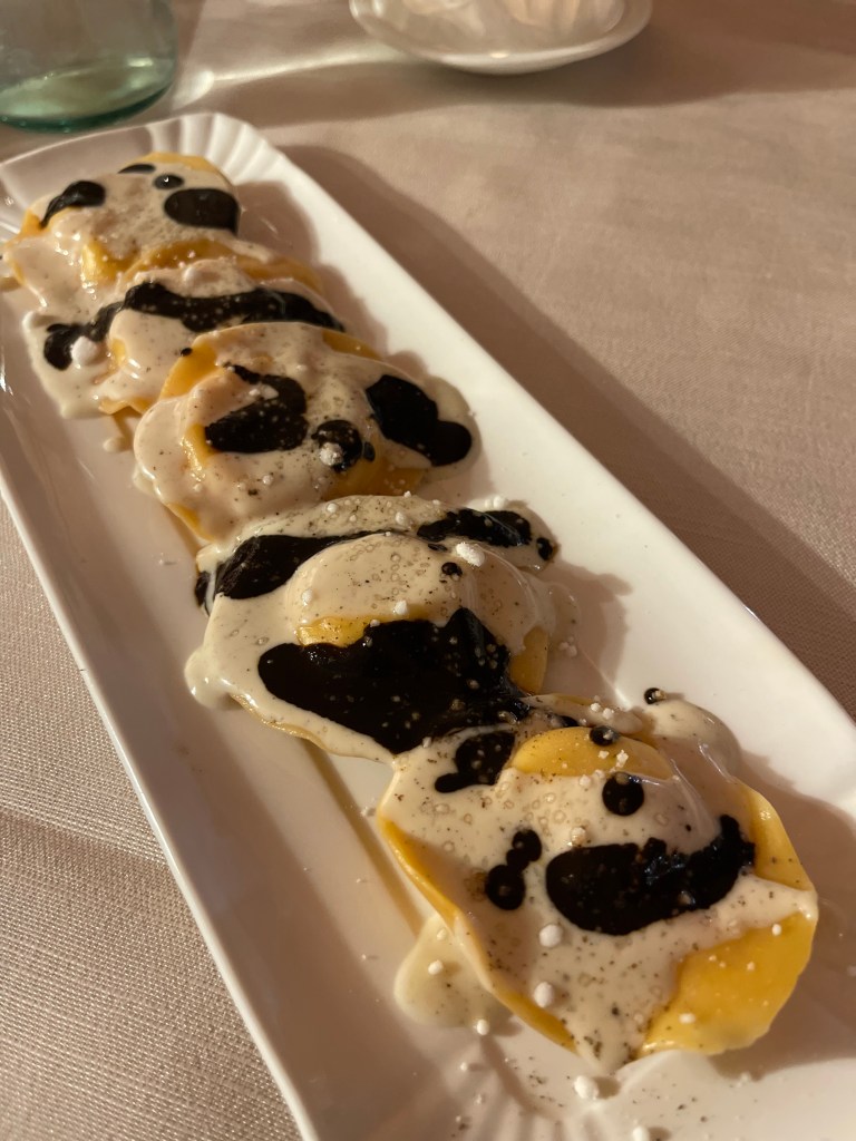 Katie's Carbonara-Filled Ravioli with Black Garlic Sauce and Pecorino Cheese Fondue at Podera la Rocca Agriturismo in Montepulciano, Italy
