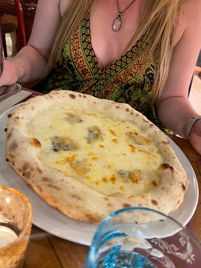 The Quattro Formaggi Pizza at Comodo Mercato Trevi in Rome.