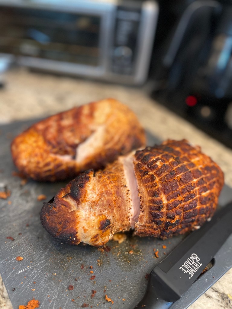 Smoked turkey breasts ready to be sliced.