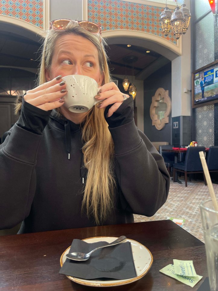 Katie having coffee at Rix Sports Bar & Grill in Disney's Coronado Springs Resort