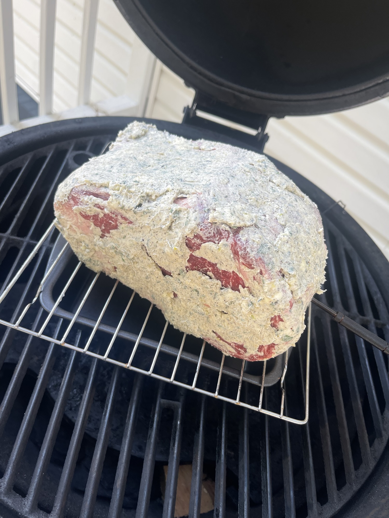 Prime Rib Roast slathered in butter and ready to smoke.