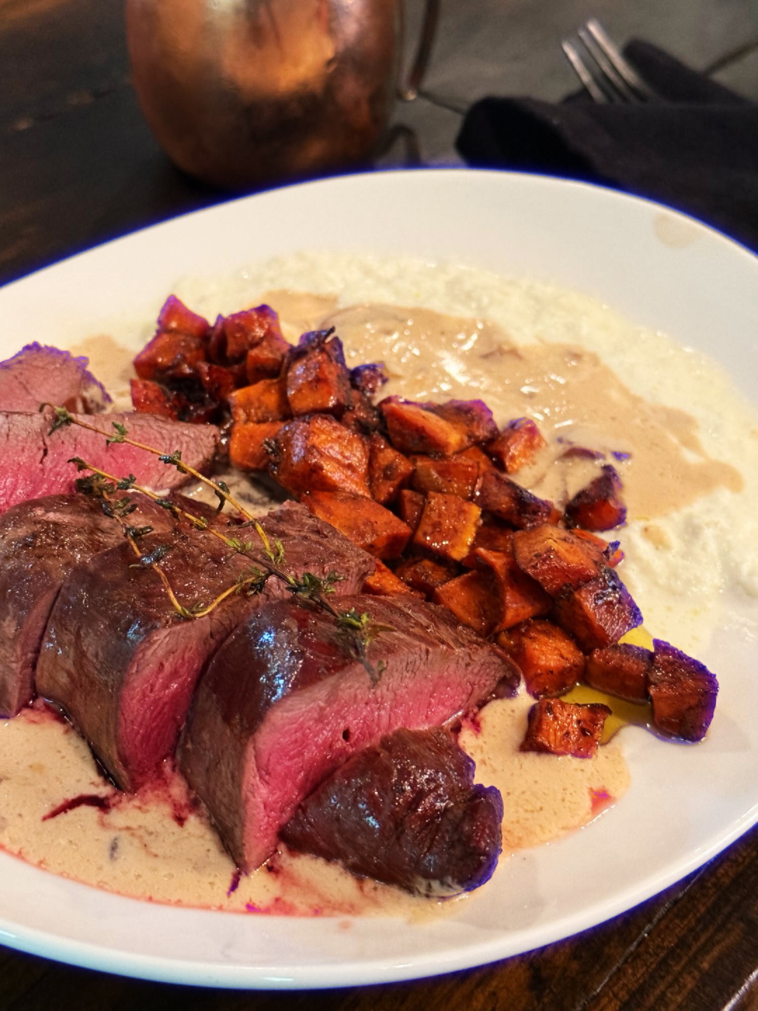 Venison tenderloin, creamed fennel, mushroom sauce and marinated sweet potatoes