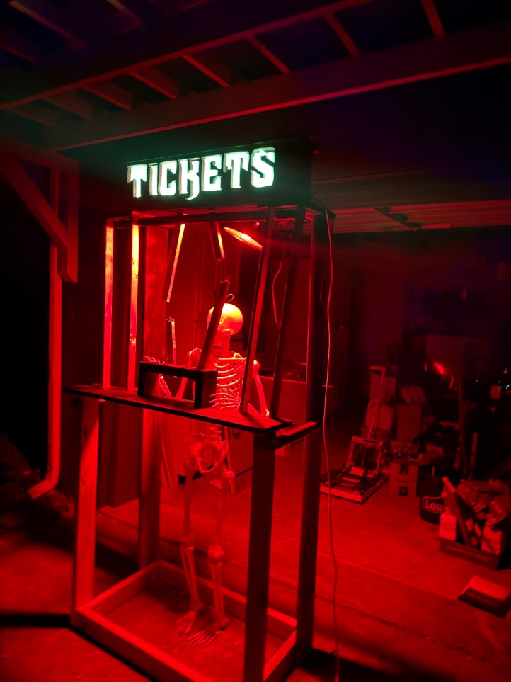 Ticket booth at night, mostly finished